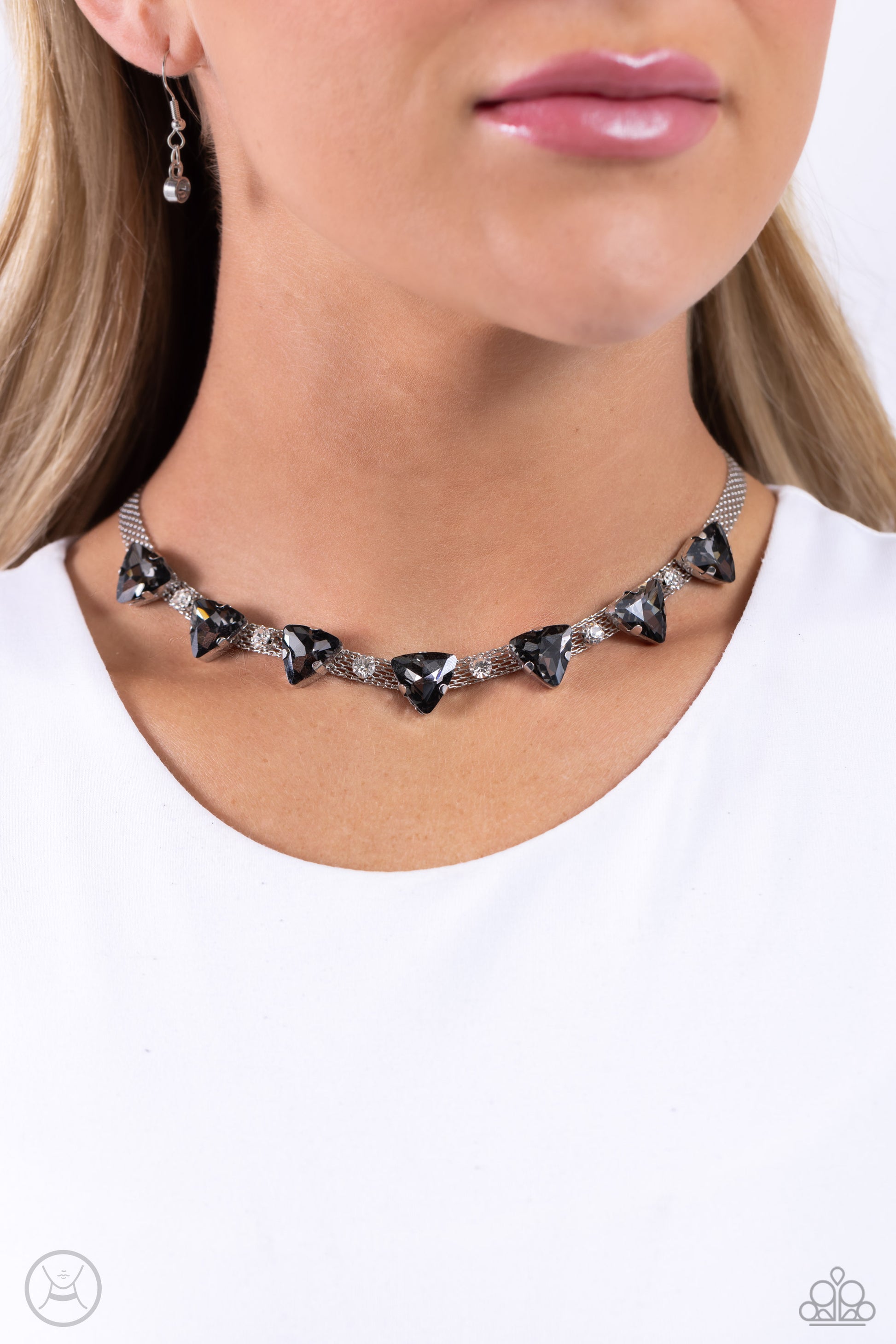 Paparazzi Accessories Strands of Sass - Silver Suspended from two silver fittings, a shimmery cascade of dainty silver chains layer around the collar for an industrial statement. Infused amongst the industrial strands, a collection of pronged white gems a
