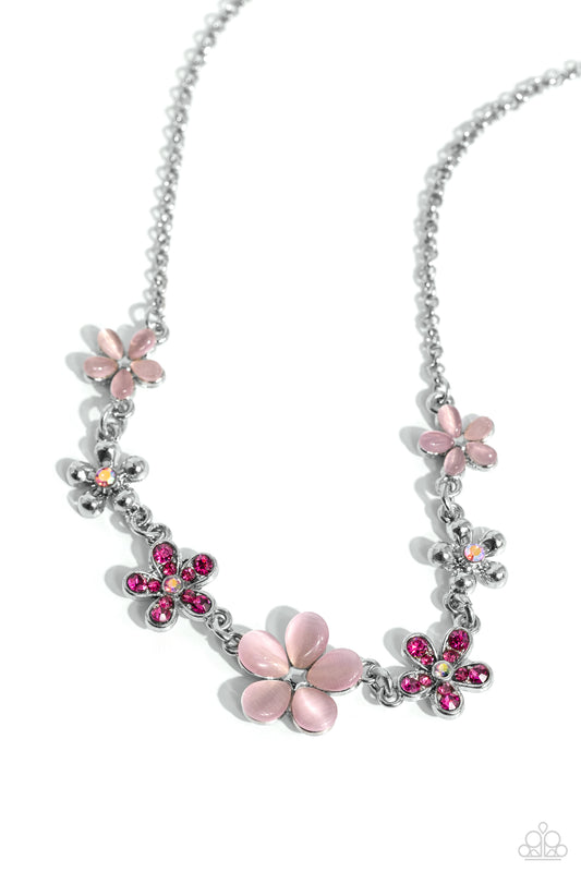 Paparazzi Accessories Spring Showcase - Pink Pink cat's eye stone petals bloom from silver stud centers, linking into various sizes of ethereal blossoms below the collar on a dainty silver chain. Silver-studded petals bloom from pink iridescent rhinestone