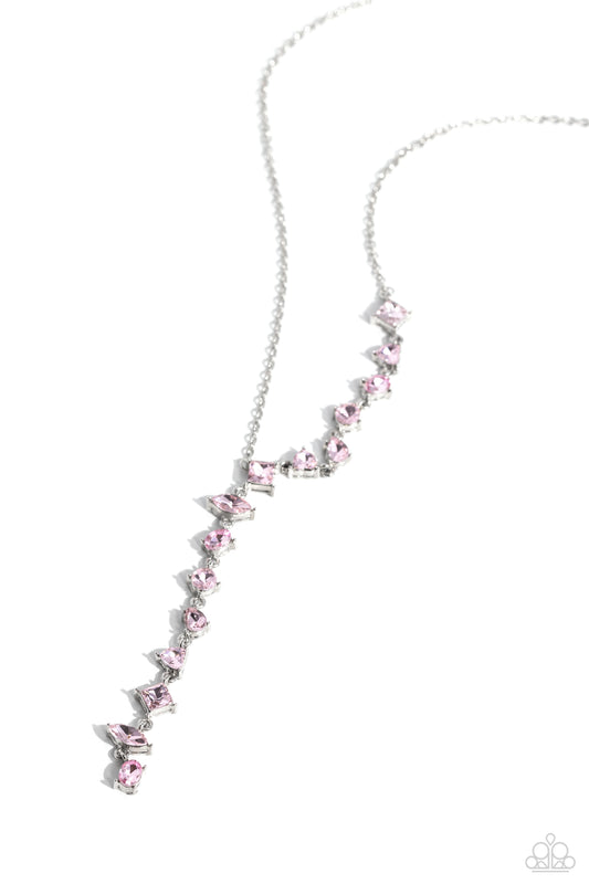 Paparazzi Accessories Diagonal Daydream - Pink Featuring pronged fittings, a collection of baby pink square-cut, heart, oval, round, and teardrop gems cascade down the neckline in a diagonal pattern, creating an intense, incandescent statement piece. Feat