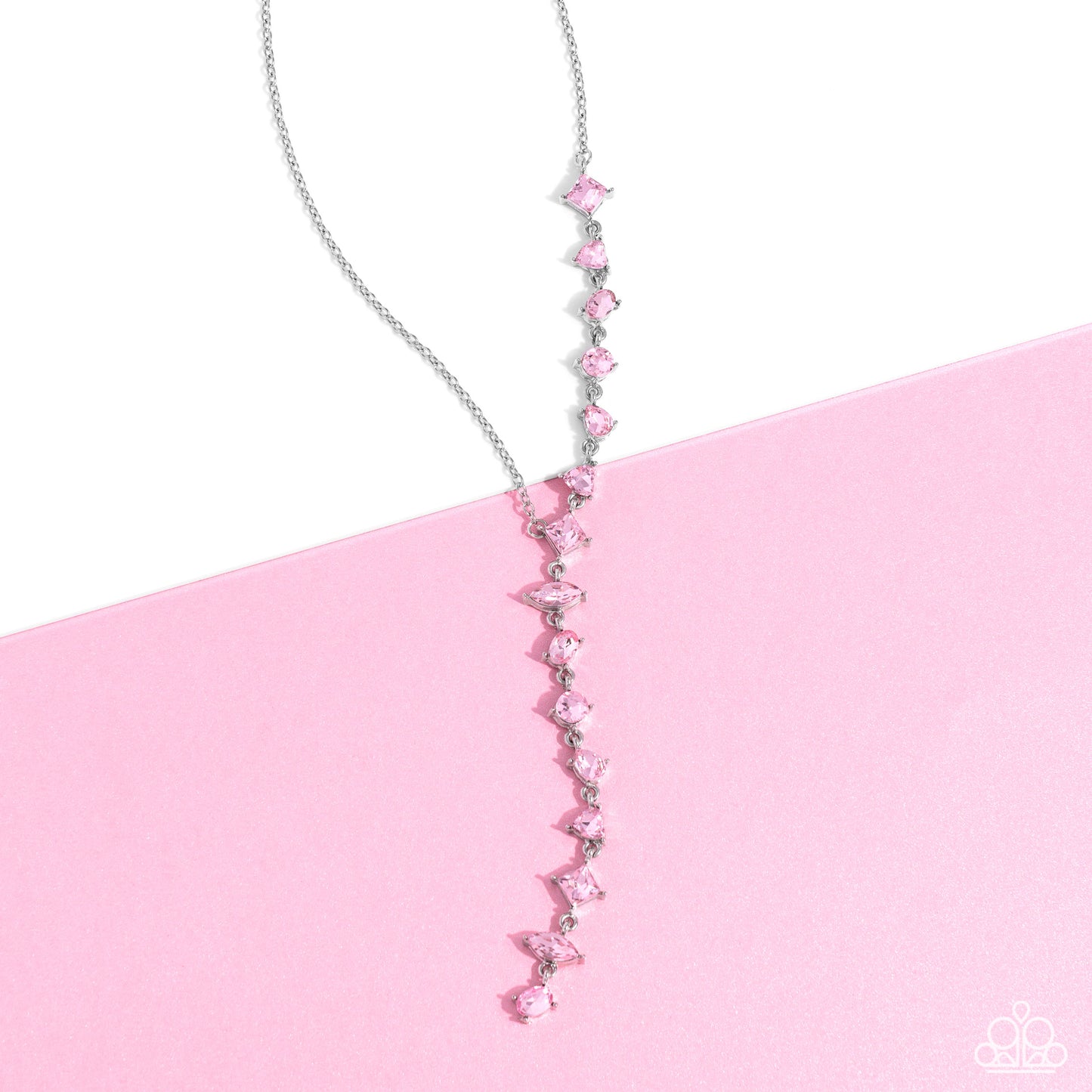 Paparazzi Accessories Diagonal Daydream - Pink Featuring pronged fittings, a collection of baby pink square-cut, heart, oval, round, and teardrop gems cascade down the neckline in a diagonal pattern, creating an intense, incandescent statement piece. Feat