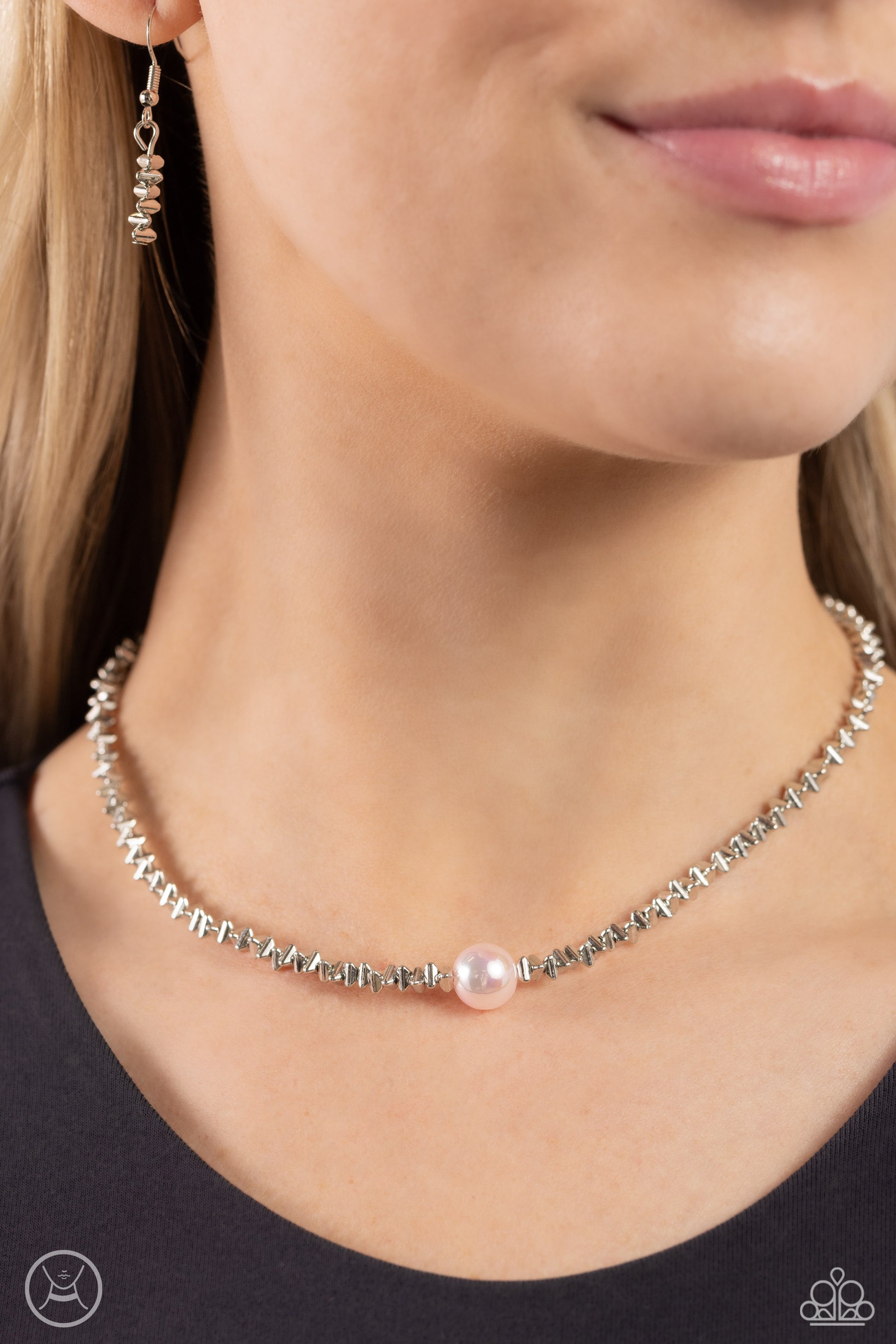 Paparazzi Accessories Tasteful Triangles - Pink Infused along an invisible string, an edgy collection of high-sheen silver triangle beads coalesces around the collar to meet a baby pink pearl at its center for a refining finish. Features an adjustable cla