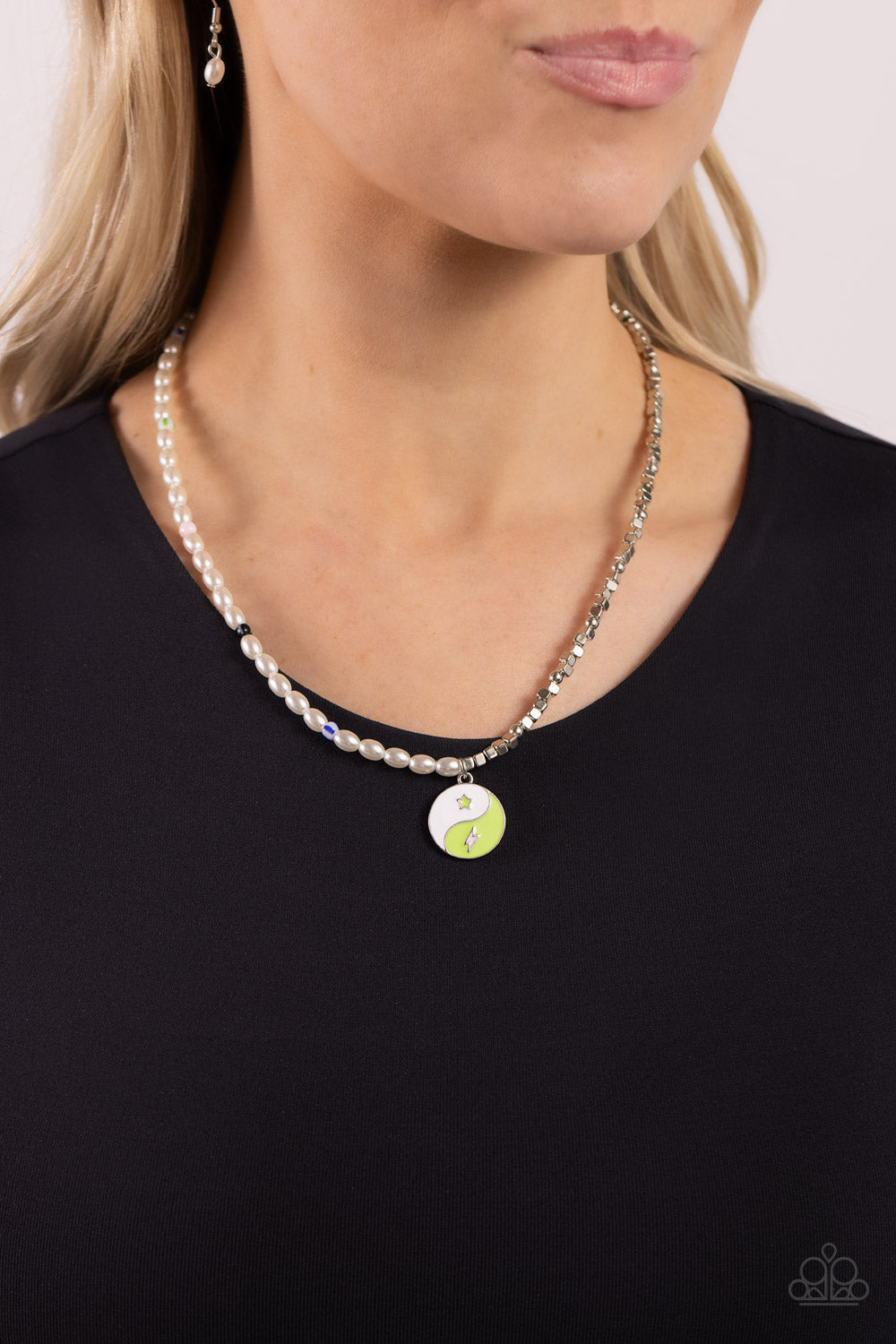 Paparazzi Accessories Youthful Yin and Yang - Green A strand of oval white pearls, sporadically infused with multicolored-striped beads, collides with cubed silver beads and studs to create an abstract blend of elegance and sheen. A yin-yang charm featuri