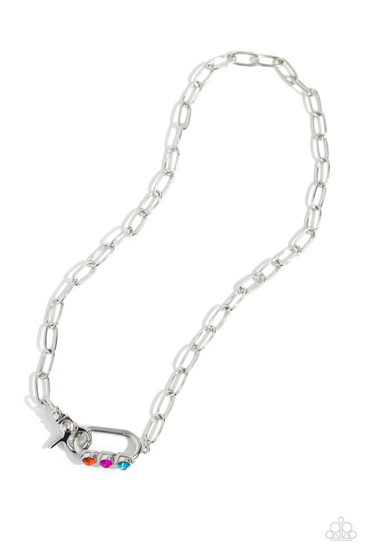 Paparazzi Accessories Dont Want to Miss a STRING - Silver Sleek, elongated silver links lead the eye down to an oversized silver carabiner frame. Encrusted along the bottom curve of the silver hardware, a trio of multicolored gems, woven across gray cordi