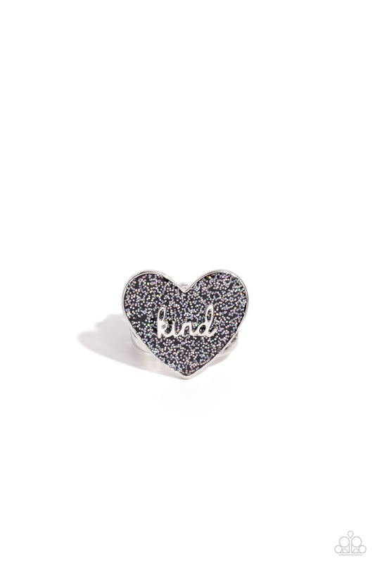 Paparazzi Accessories Compassionate Couture - Black Brushed in a glittery iridescent finish, a black heart frame rests atop airy silver bands for a retro glamorous look. The word "kind" is centered atop the heart frame for an optimistic finish. Features a