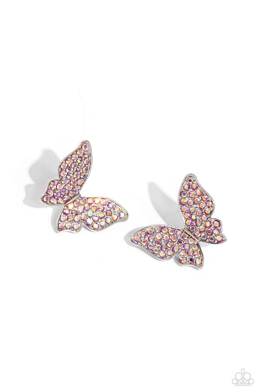 Paparazzi Accessories High Life - Pink Featuring a tilted motif, a silver butterfly encrusted with an explosion of pink iridescent rhinestones sparkles at the ear for an enchanting fashion. Earring attaches to a standard post fitting. Due to its prismatic