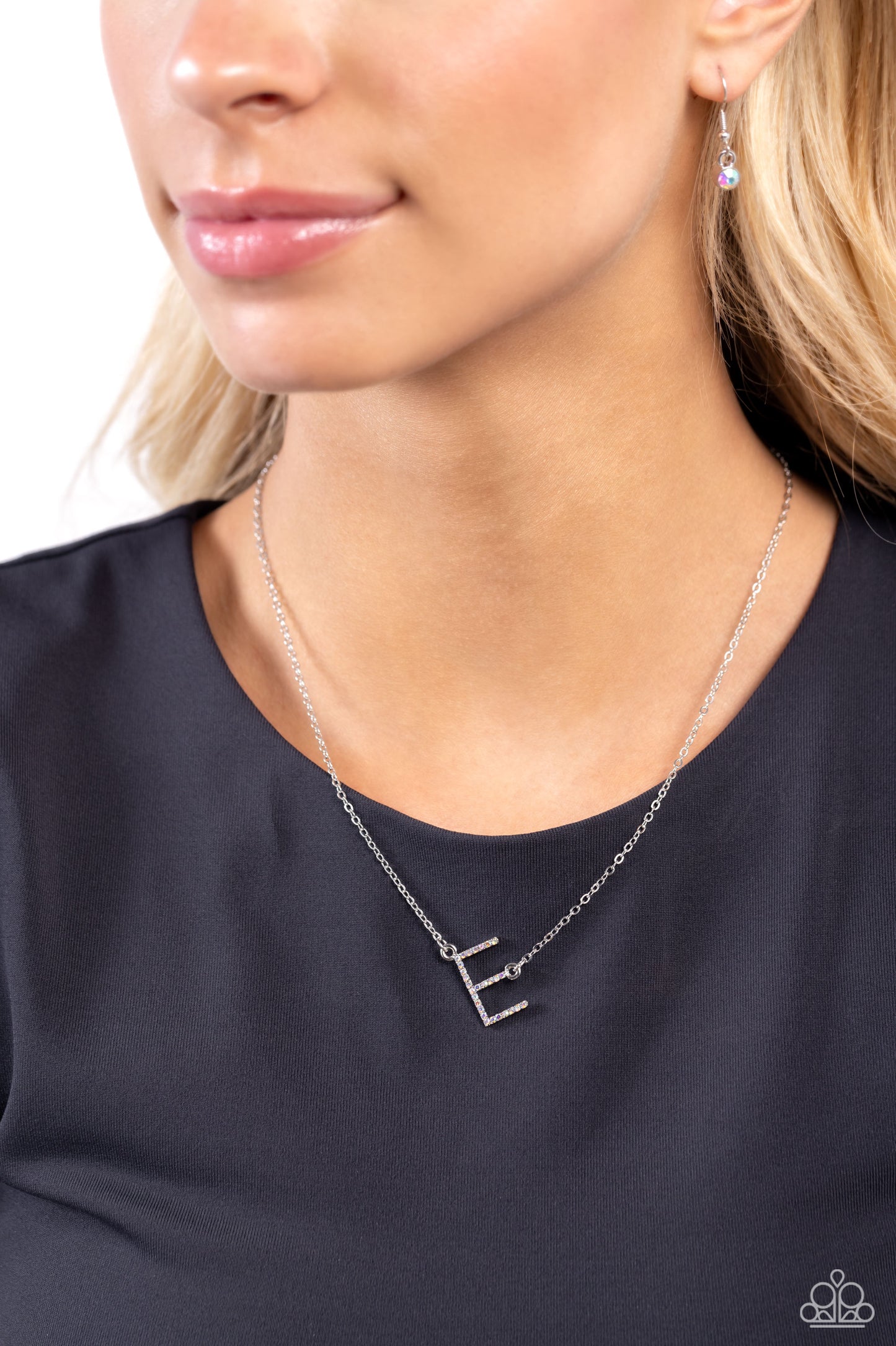 Paparazzi Accessories INITIALLY Yours - E - Multi Embossed with dainty iridescent rhinestones, a silver letter "E" hovers below the collar from a dainty silver chain, for a sentimentally simple design. Features an adjustable clasp closure. Due to its pris