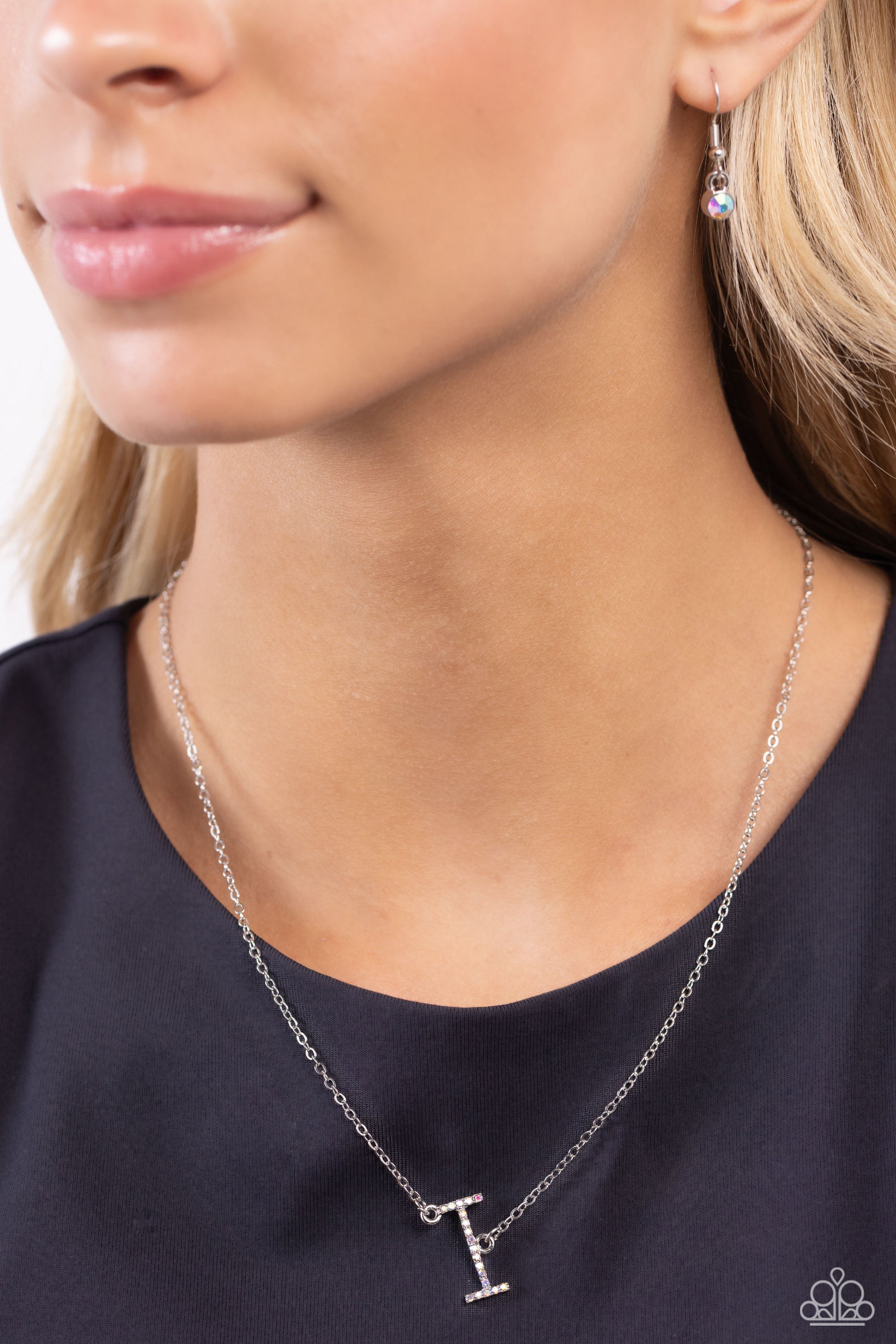 Paparazzi Accessories INITIALLY Yours - I - Multi Embossed with dainty iridescent rhinestones, a silver letter "I" hovers below the collar from a dainty silver chain, for a sentimentally simple design. Features an adjustable clasp closure. Due to its pris