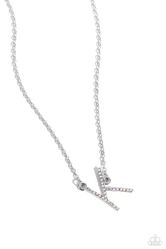 Paparazzi Accessories INITIALLY Yours - K - Multi Embossed with dainty iridescent rhinestones, a silver letter "K" hovers below the collar from a dainty silver chain, for a sentimentally simple design. Features an adjustable clasp closure. Due to its pris