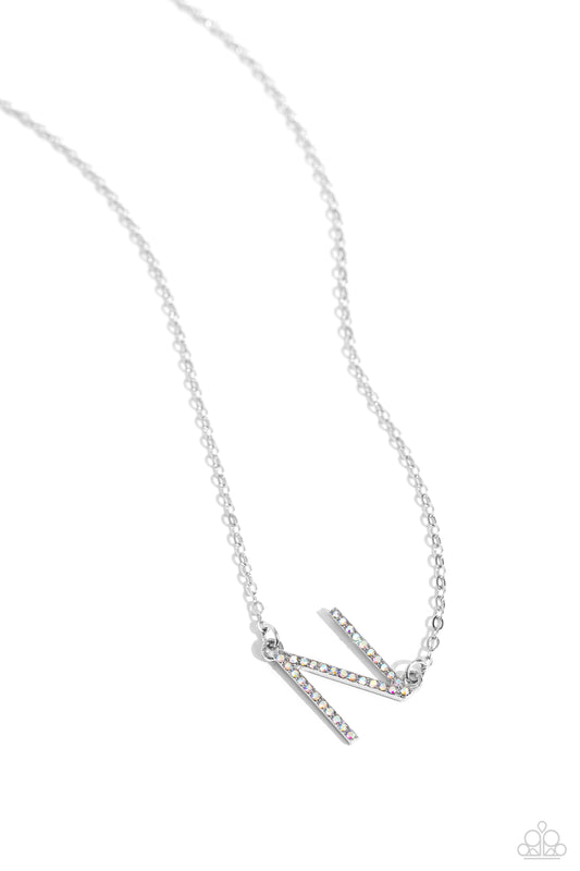 Paparazzi Accessories INITIALLY Yours - N - Multi Embossed with dainty iridescent rhinestones, a silver letter "N" hovers below the collar from a dainty silver chain, for a sentimentally simple design. Features an adjustable clasp closure. Due to its pris