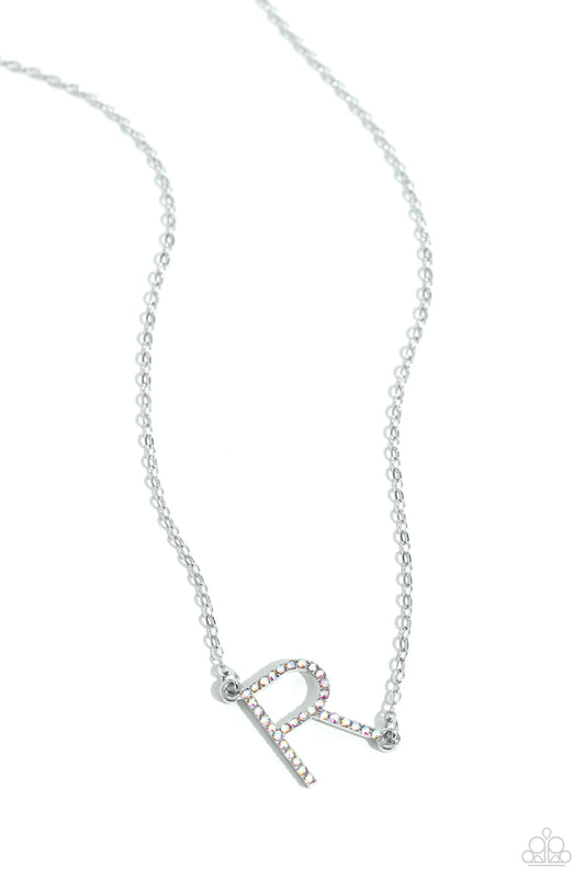 Paparazzi Accessories INITIALLY Yours - R - Multi Embossed with dainty iridescent rhinestones, a silver letter "R" hovers below the collar from a dainty silver chain, for a sentimentally simple design. Features an adjustable clasp closure. Due to its pris