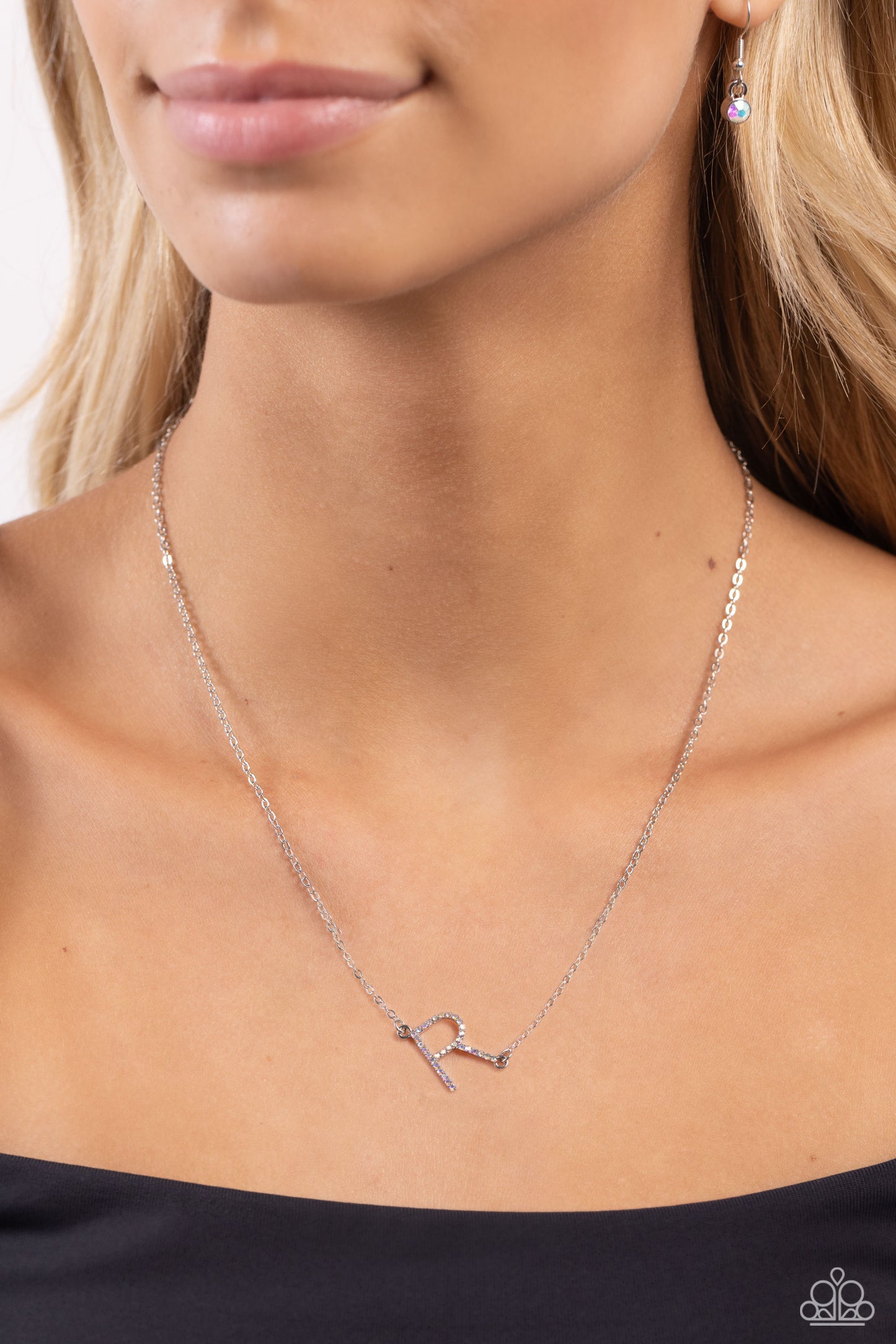 Paparazzi Accessories INITIALLY Yours - R - Multi Embossed with dainty iridescent rhinestones, a silver letter "R" hovers below the collar from a dainty silver chain, for a sentimentally simple design. Features an adjustable clasp closure. Due to its pris