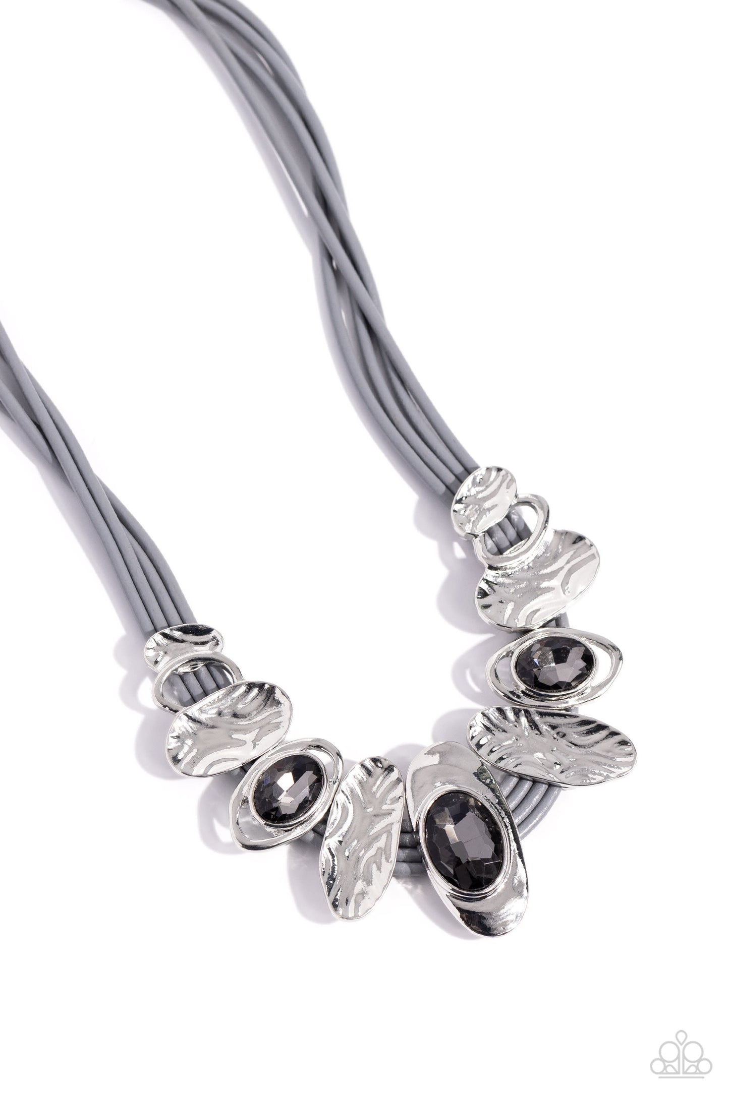 Paparazzi Accessories Sliding Splendor - Silver Featuring a lightly hammered sheen, asymmetrical silver ovals, some with airy silhouettes and exaggerated smoky gem centers, give off a hand-made feel as they shift and slide through multiple strands of gray
