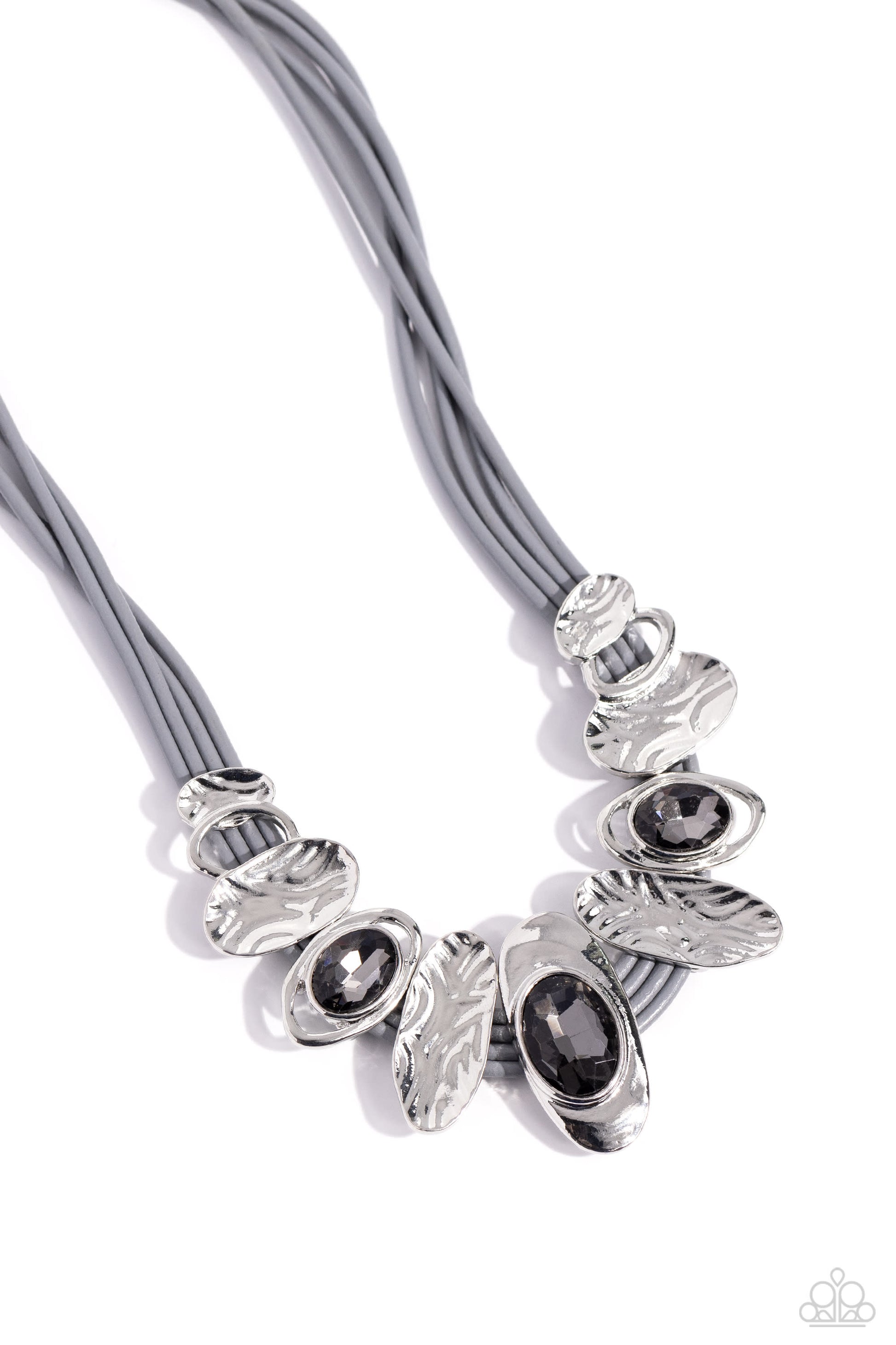 Paparazzi Accessories Sliding Splendor - Silver Featuring a lightly hammered sheen, asymmetrical silver ovals, some with airy silhouettes and exaggerated smoky gem centers, give off a hand-made feel as they shift and slide through multiple strands of gray