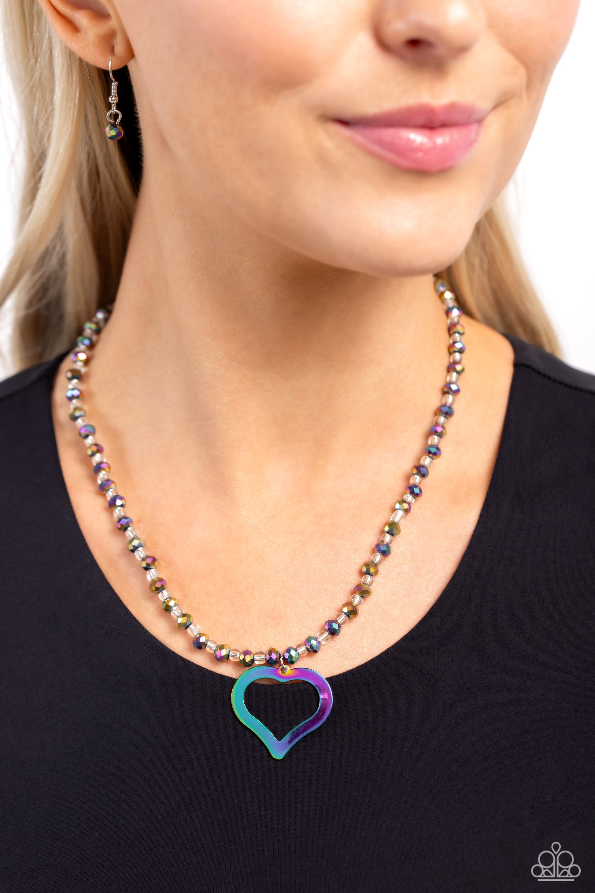 Paparazzi Accessories Faceted Factor - Multi Infused along an invisible string, a collection of faceted oil spill beads alternate with clear beads to create a dazzling display below the neckline. An airy oil spill heart dangles from the high-sheen display