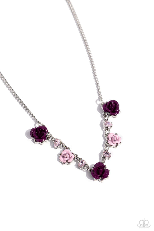 Paparazzi Accessories Strike a ROSE - Purple Painted in plum and baby pink hues, various metal roses delicately alternate with upside-down pink teardrop gems across a dainty silver chain, blooming into a seasonal centerpiece. Features an adjustable clasp