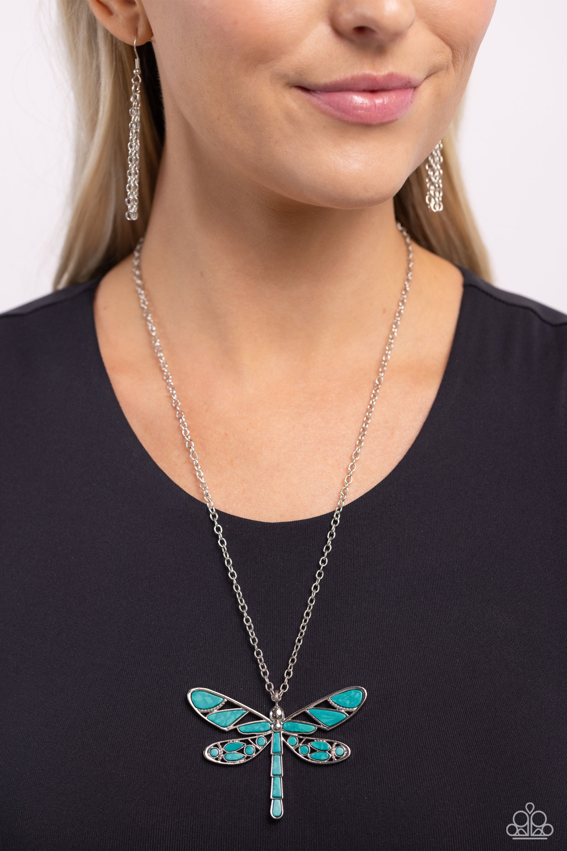 Paparazzi Accessories FLYING Low - Green Featuring a classic silver chain, various cuts of green, teal-like stone are passed into an oversized, airy silver dragonfly pendant for a rustically earthy centerpiece. Features an adjustable clasp closure. As the