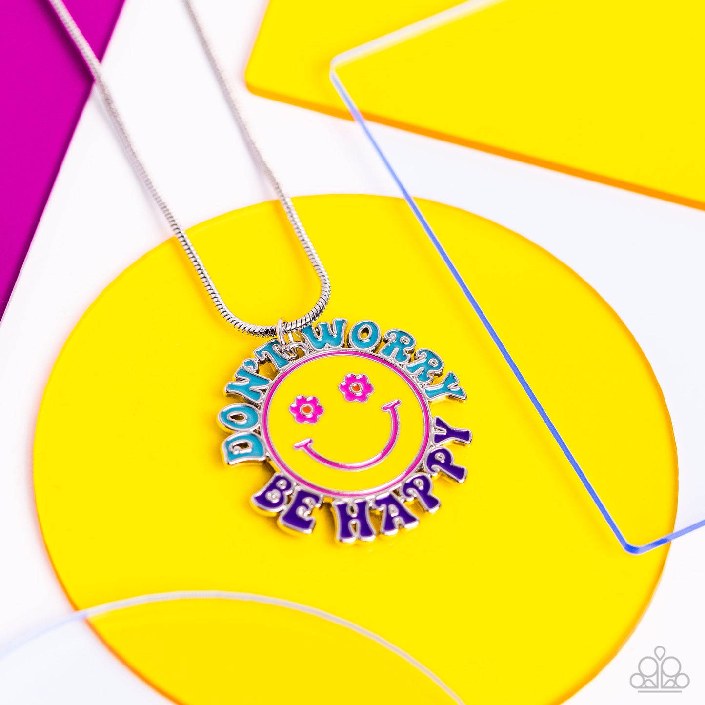 Paparazzi Accessories Dont Worry, Stay Happy - Multi A glistening yellow-painted disc is stamped with Pink Peacock and orange smiley face details. The phrase "Don't Worry" and "Be Happy" "wrap around the outside of the floral-inspired smiley face in turqu