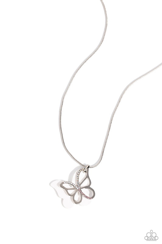 Paparazzi Accessories Detailed Dance - White Layered beside a silver butterfly silhouette dotted with pink, iridescent, and opalescent rhinestones, a white-painted acrylic butterfly flutters from a silver snake chain below the collar for a whimsical fashi
