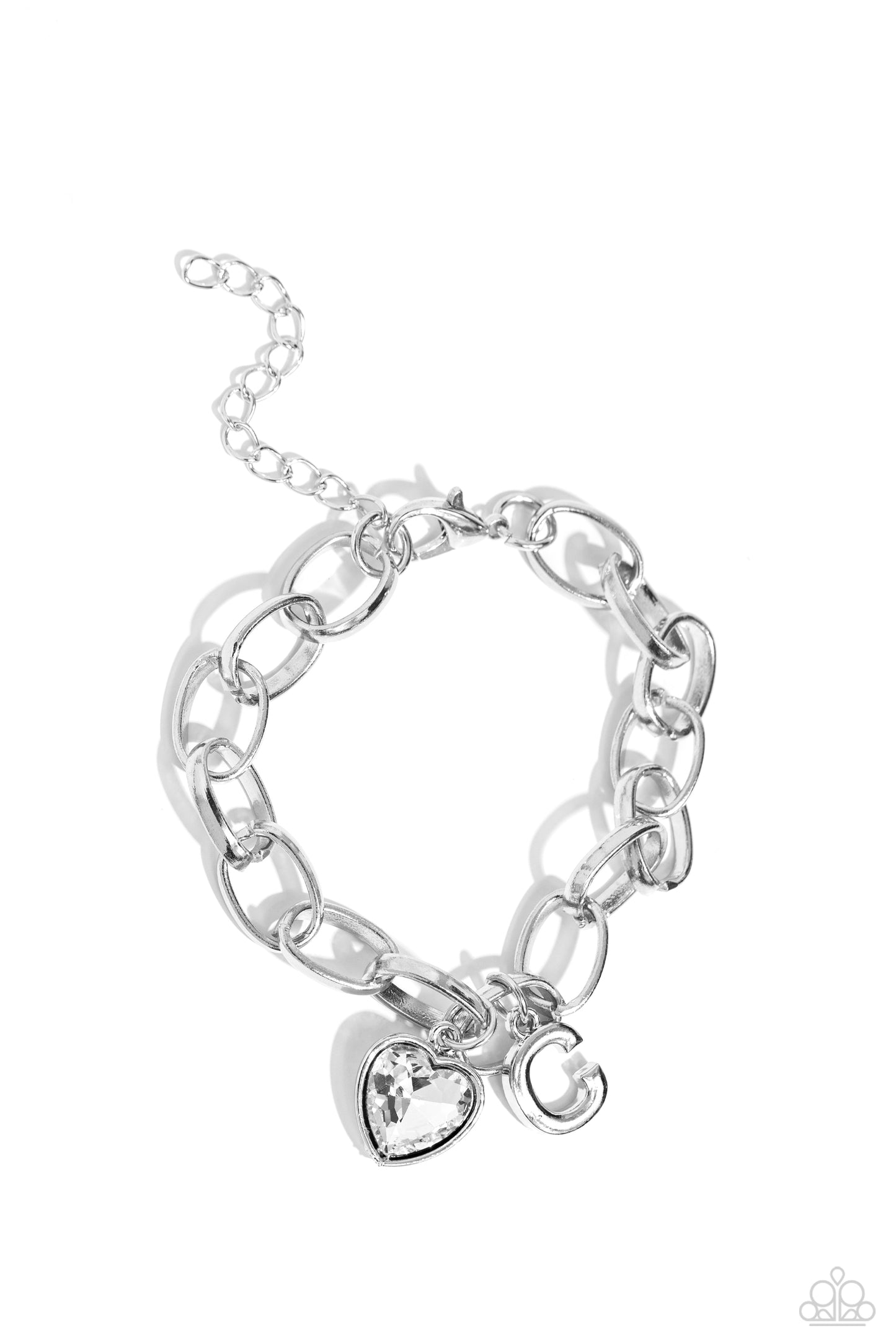 Paparazzi Accessories Guess Now Its INITIAL - White - C A simple collection of silver charms — including a white rhinestone heart pressed in a silver frame and a sleek letter "C" — dance from a chunky silver chain around the wrist, creating a sentimental