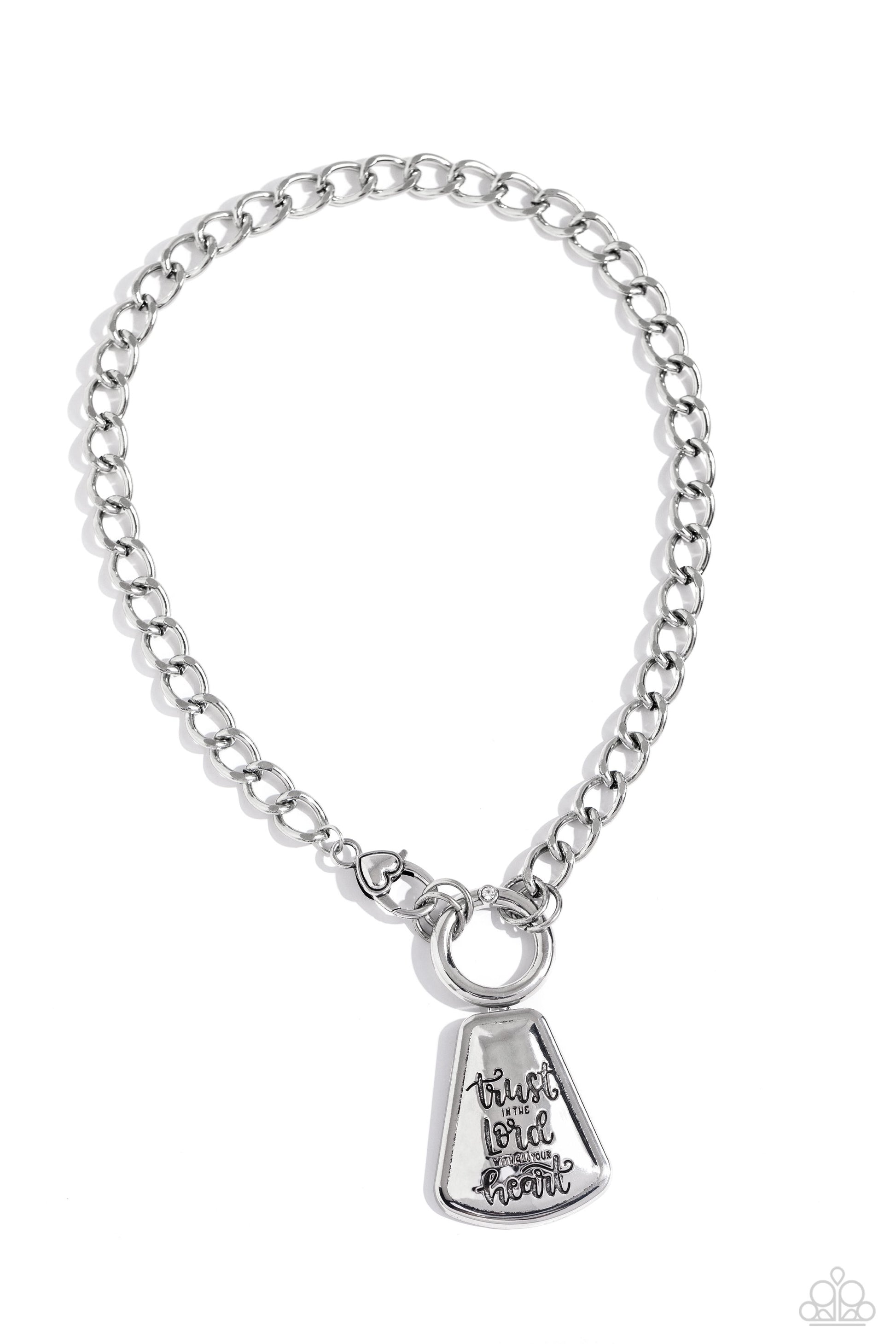 Paparazzi Accessories Trust and Believe - Silver Cascading from a silver curb chain, an exaggerated silver pendant is stamped with the phrase "trust in the Lord with all your heart" for a religious-inspired centerpiece. A tactile silver heart adorns the c