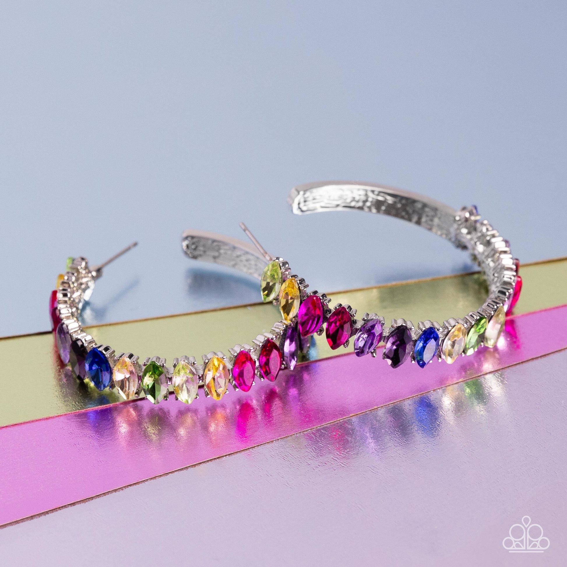 Paparazzi Accessories Rainbow Range - Multi Dazzling colorful marquise-cut gems fall in line along the front edge of a classic silver hoop. The exposed edges create a gritty silhouette, beautifully contrasting with the blinding shimmer of the gems in a st