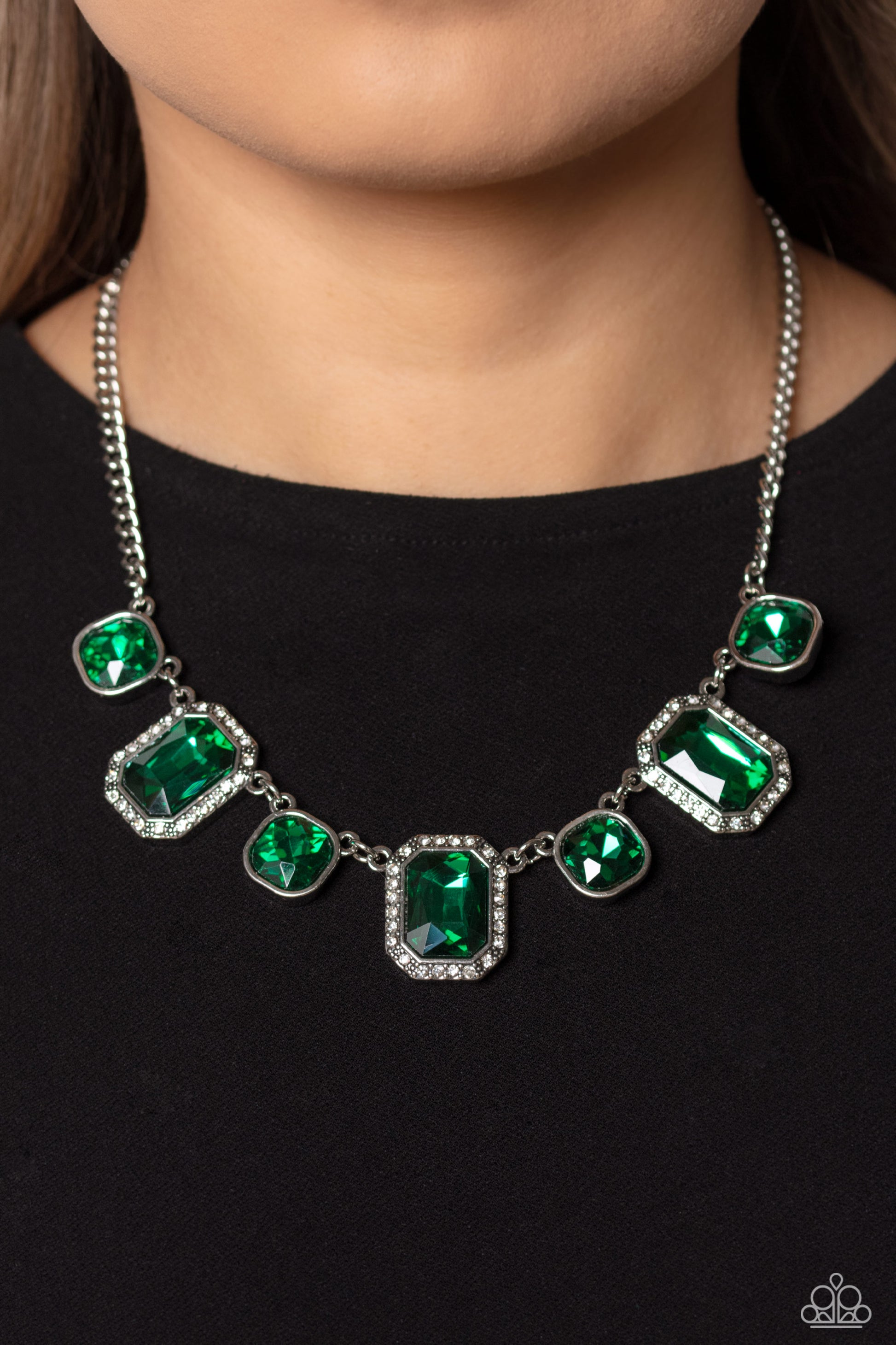 Paparazzi Accessories Royal Rumble - Green Dazzling gems, in both round and emerald-cuts, fall along the collar in an alternating pattern. Each gem is splashed in an emerald green hue amplifying its impact, while the emerald-cut gems showcase some glitter