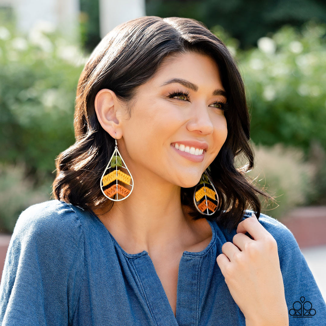 Paparazzi Accessories Nice Threads - Multi Colorful sections of shiny Olive Branch, mustard, and Adobe threads decoratively weave along arched silver bars inside of a shiny silver teardrop, resulting into an earthy lure. Earring attaches to a standard fis