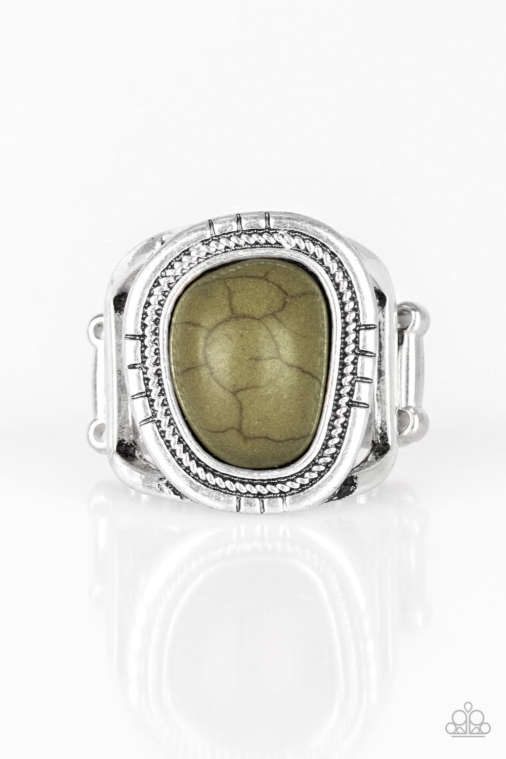 Paparazzi Accessories Out On The Range - Green An earthy Military Olive stone is pressed into an asymmetrical silver frame radiating with tactile textures for a seasonal look. Features a stretchy band for a flexible fit. Sold as one individual ring. Jewel