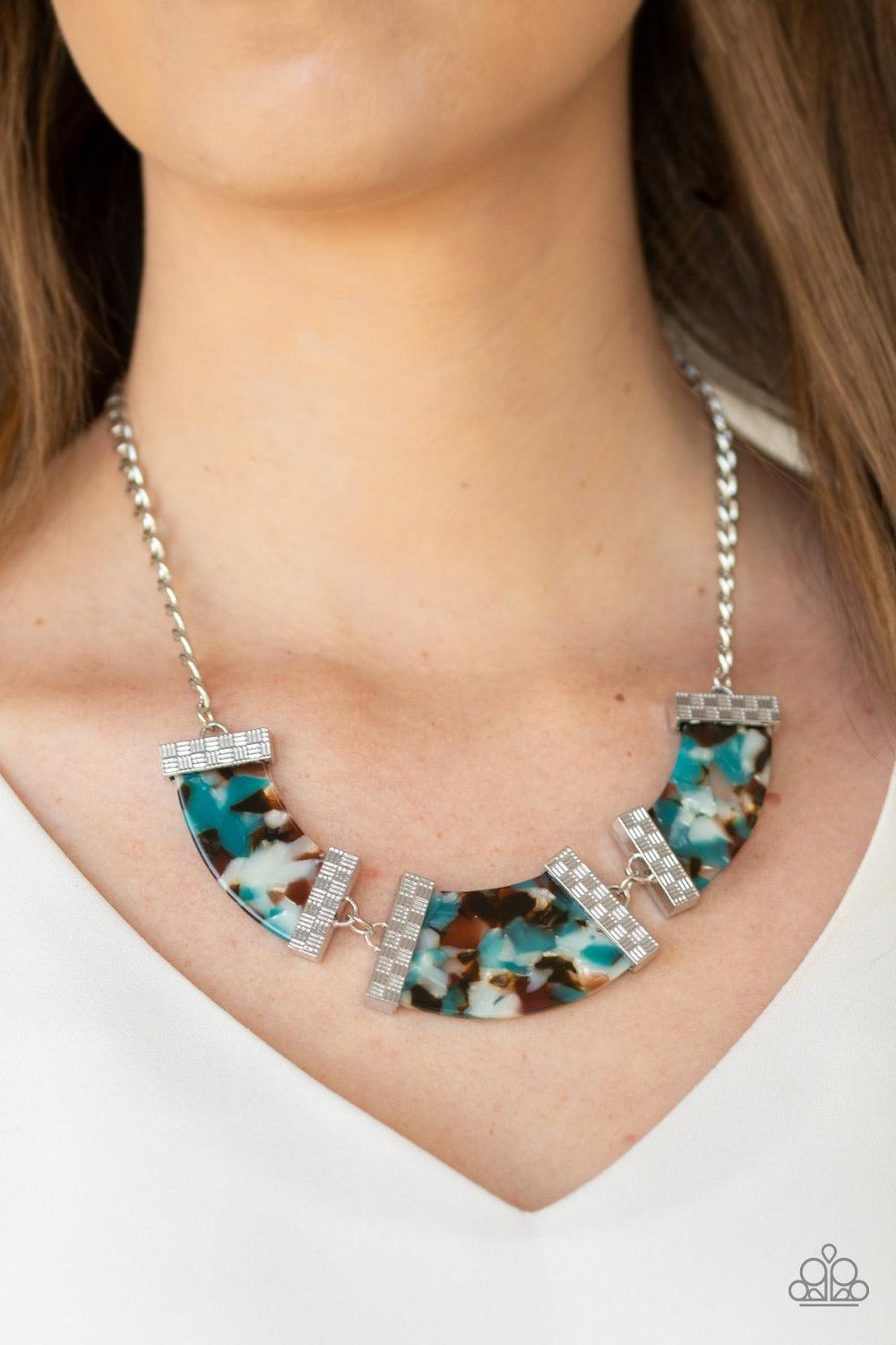 Paparazzi Accessories HAUTE-Blooded - Blue Speckled with color, a trio of blue acrylic frames are nestled inside checker textured silver fittings as they link below the collar for a seasonal flair. Features an adjustable clasp closure. Jewelry