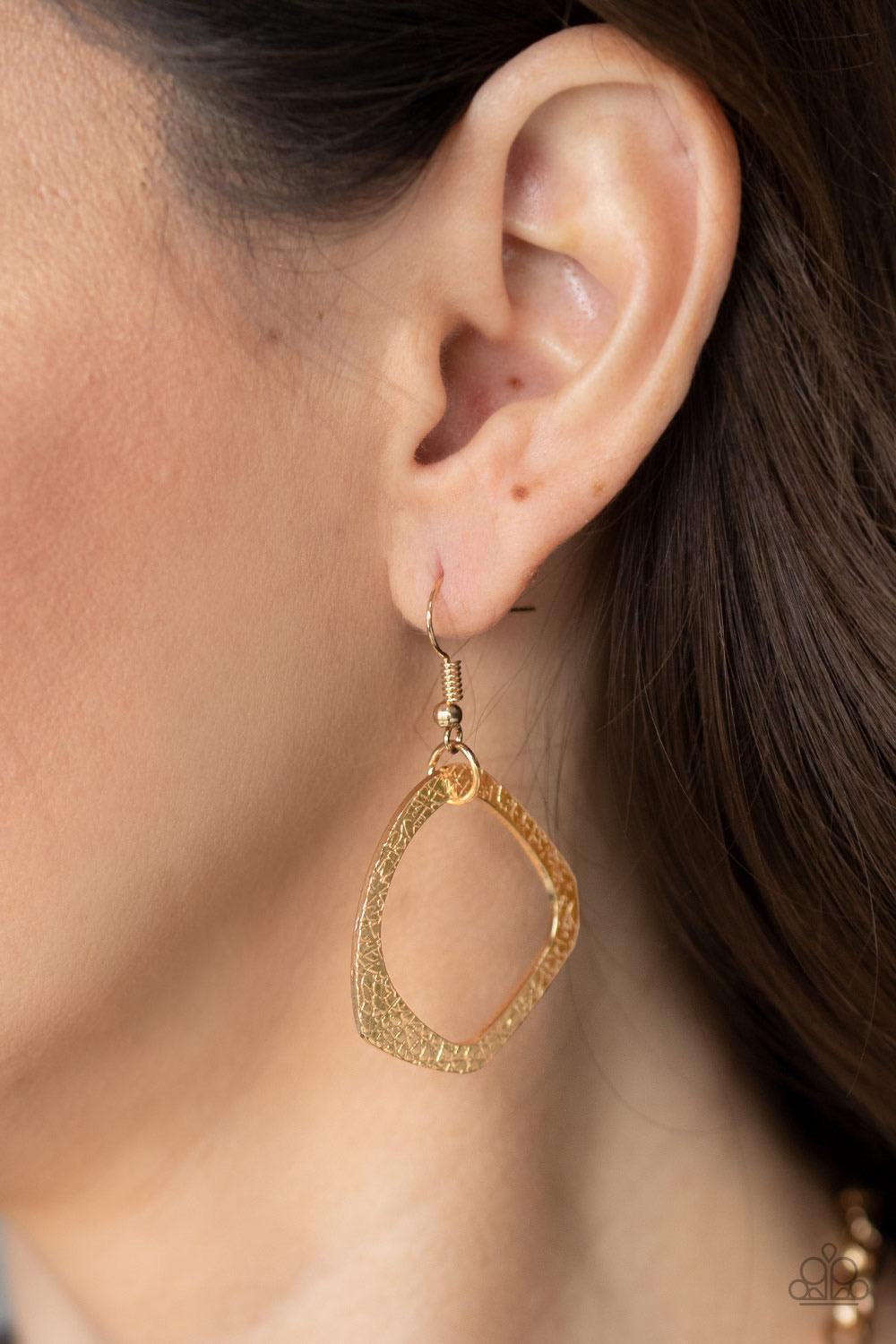 Paparazzi Accessories Salvage Yard - Gold Hammered in shimmery detail, oversized asymmetrical gold rings and gritty gold links boldly link below the collar in two dramatic rows for a sassy industrial look. Features an adjustable clasp closure. Sold as one