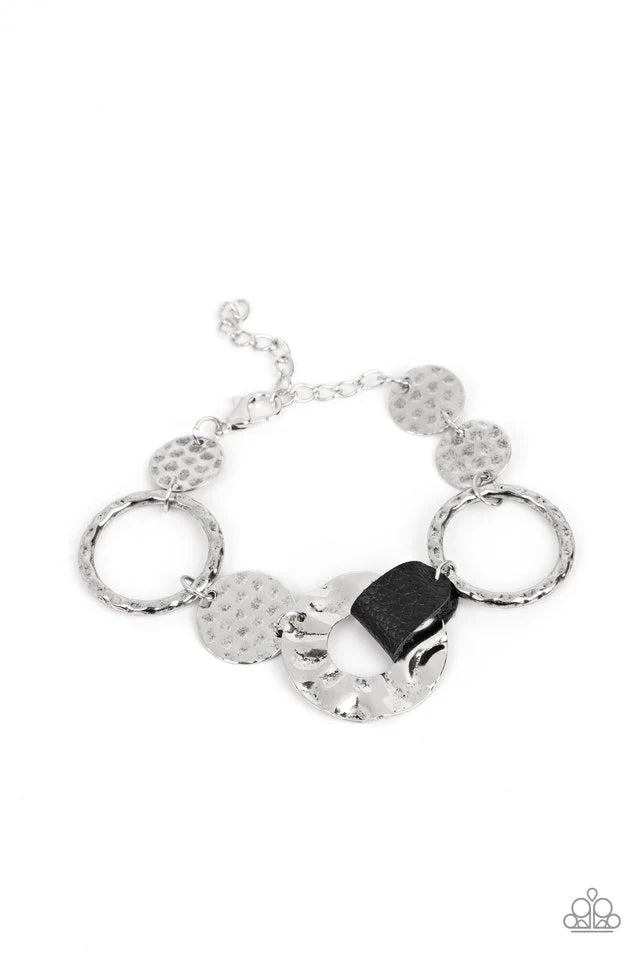Paparazzi Accessories Desert Scraps - Black Desert Scraps is a bracelet made of gold and silver discs hammered in a handcrafted texture. This piece represents the beauty in things that cannot be seen with the naked eye, such as the intricate patterns foun