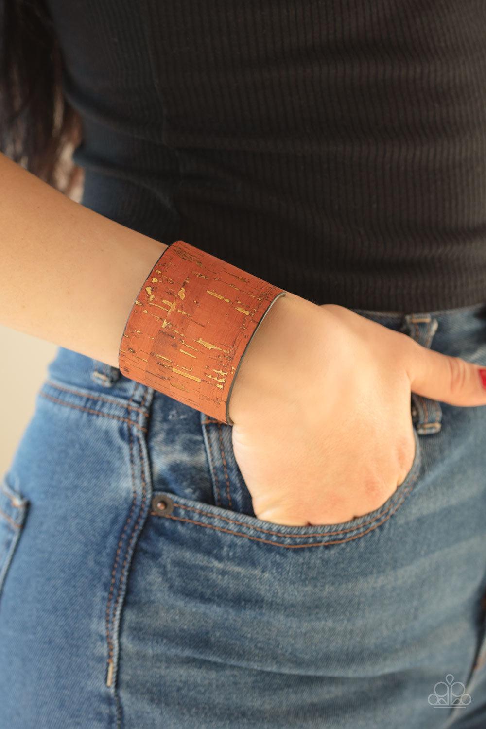 Paparazzi Accessories Up To Scratch - Orange Featuring an orange cork-like finish, a thick cuff is scratched, revealing lines of golden shimmer for a seasonal look. Jewelry