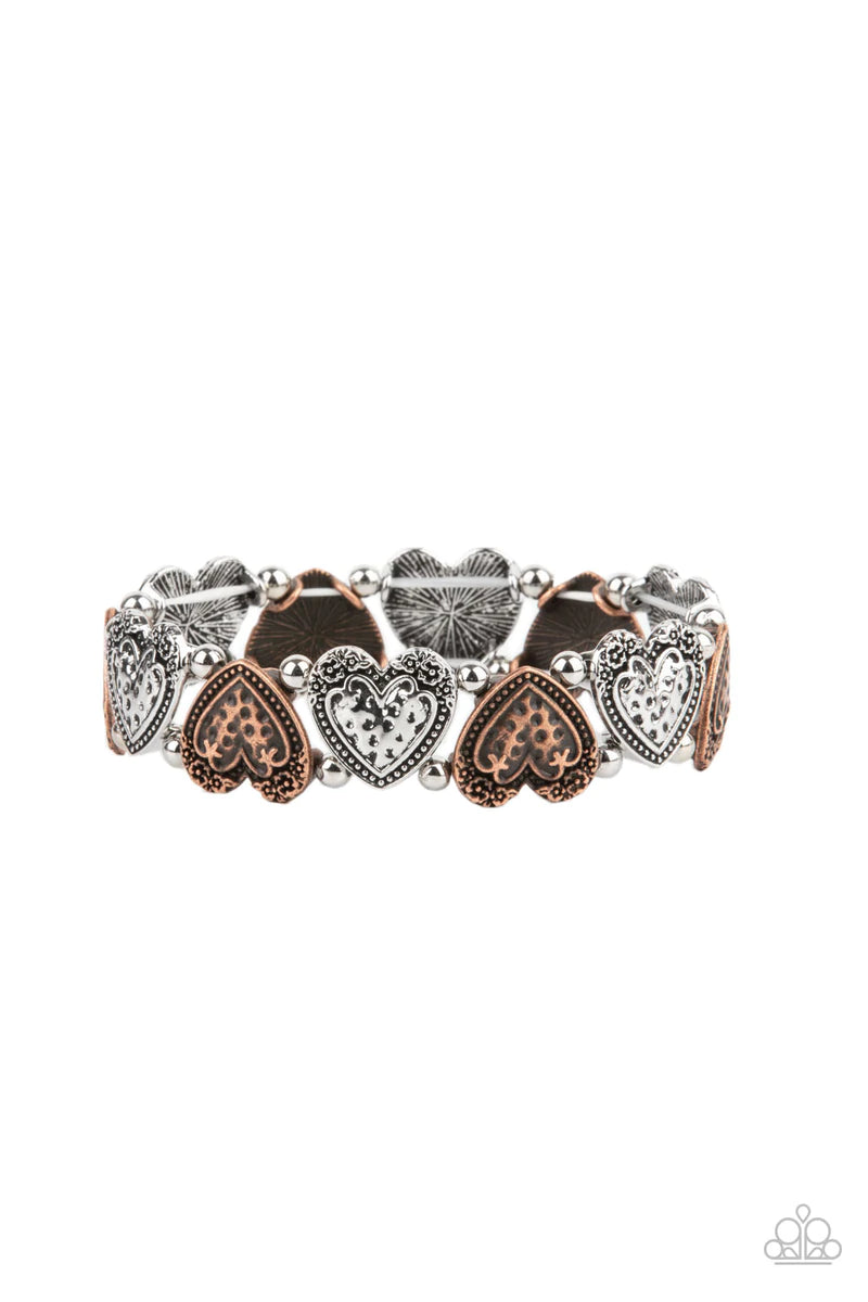 Paparazzi Accessories Rustic Heartthrob - Multi Adorned in dainty floral accents, hammered copper and silver heart frames and classic silver beads are threaded along stretchy bands around the wrist for a romantically rustic look. Sold as one individual br