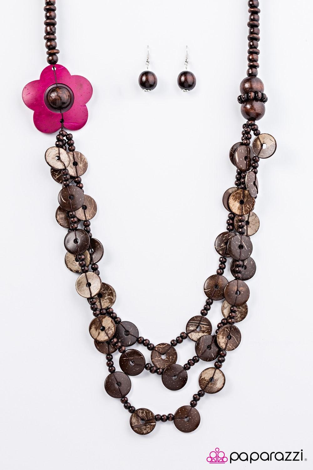Paparazzi Accessories Honolulu Hula - Pink Shiny wooden beads trickle along a brown thread, creating an earthy chain. Tinted in a vibrant pink finish, a wooden floral accent gives way to dramatic layers of wooden beads and wooden discs for a summery finis
