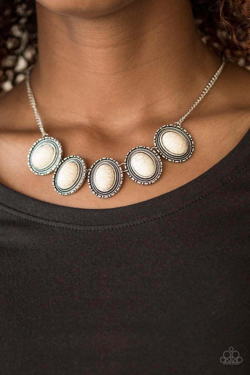 Paparazzi Accessories Bet The Ranch - White Smooth white stones are pressed into ornate silver frames. Brushed in an antiqued finish, the earthy frames link below the collar in a seasonal southwestern fashion. Sold as one individual necklace. Includes one