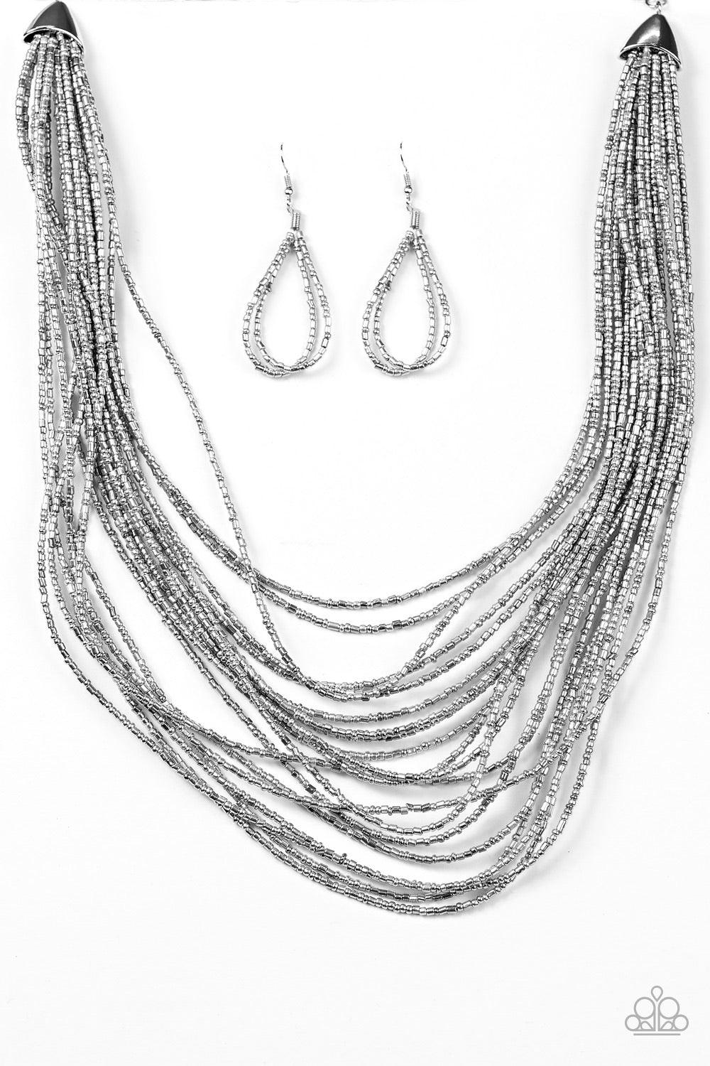 Paparazzi Accessories Ice Age Radiance - Silver Brushed in an icy metallic shimmer, strands of dainty seed beads layer below the collar in an edgy fashion. Features an adjustable clasp closure. Jewelry