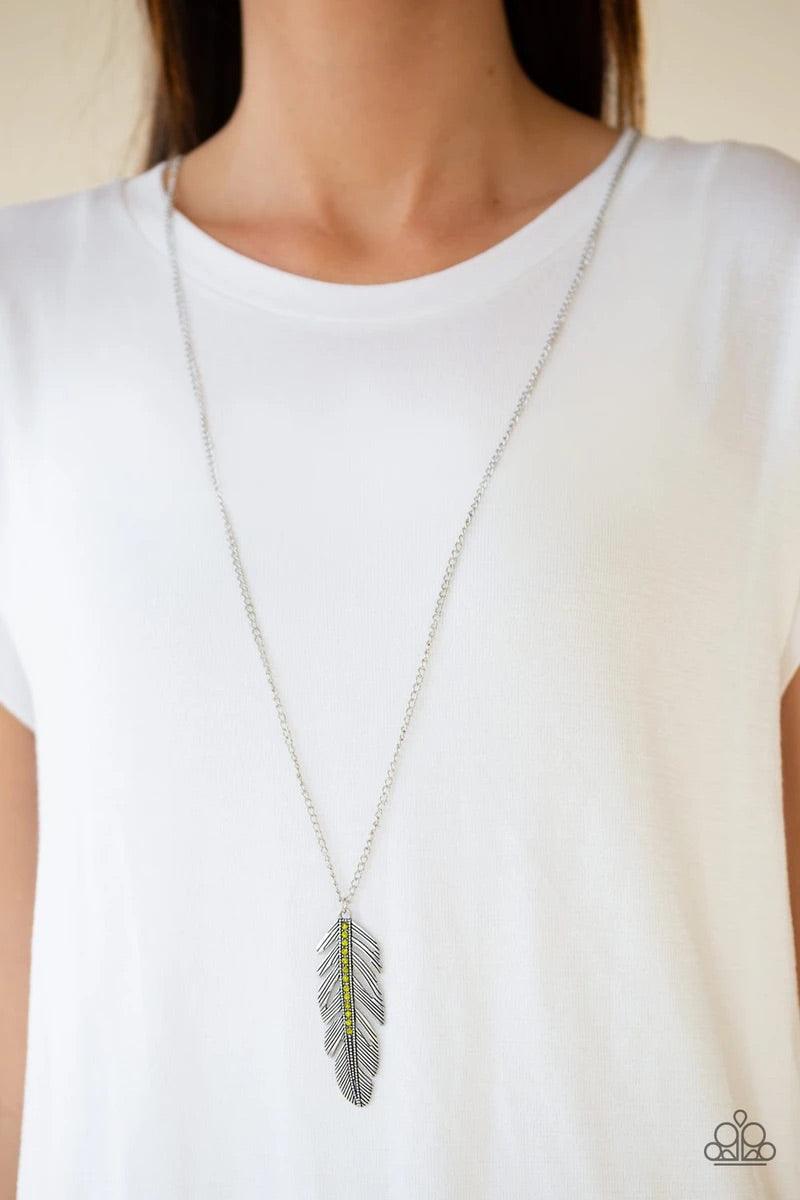 Paparazzi Accessories Sky Quest - Green Glittery green rhinestones are encrusted down the spine of a life-like silver feather. The whimsical pendant swings from the bottom of a lengthened silver chain for a seasonal look. Features an adjustable clasp clos