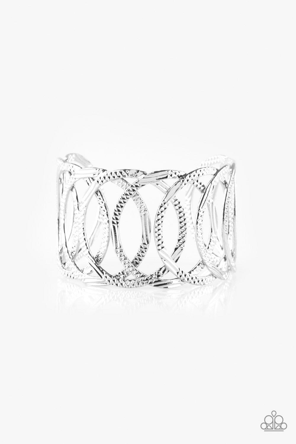 Paparazzi Accessories Circa De Contender - Silver Etched and hammered in linear and diamond-cut shimmer, glistening silver circles join into a dramatic cuff around the wrist. Jewelry