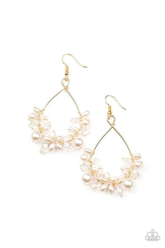 Paparazzi Accessories Marina Banquet - Gold A bubbly collection of white pearls and white crystal-like beads are threaded along the bottom of a dainty gold wire hoop, creating twinkly floral accents. Earring attaches to a standard fishhook fitting. Jewelr