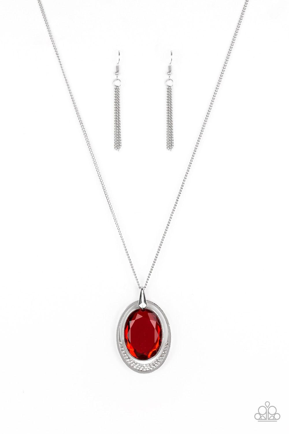 Paparazzi Accessories Metro Must Have - Red An oversized red gem swings from the top of an airy silver frame, creating a refined double pendant at the bottom of a lengthened silver chain. As if dipped in glitter, the bottom of the silver frame is encruste