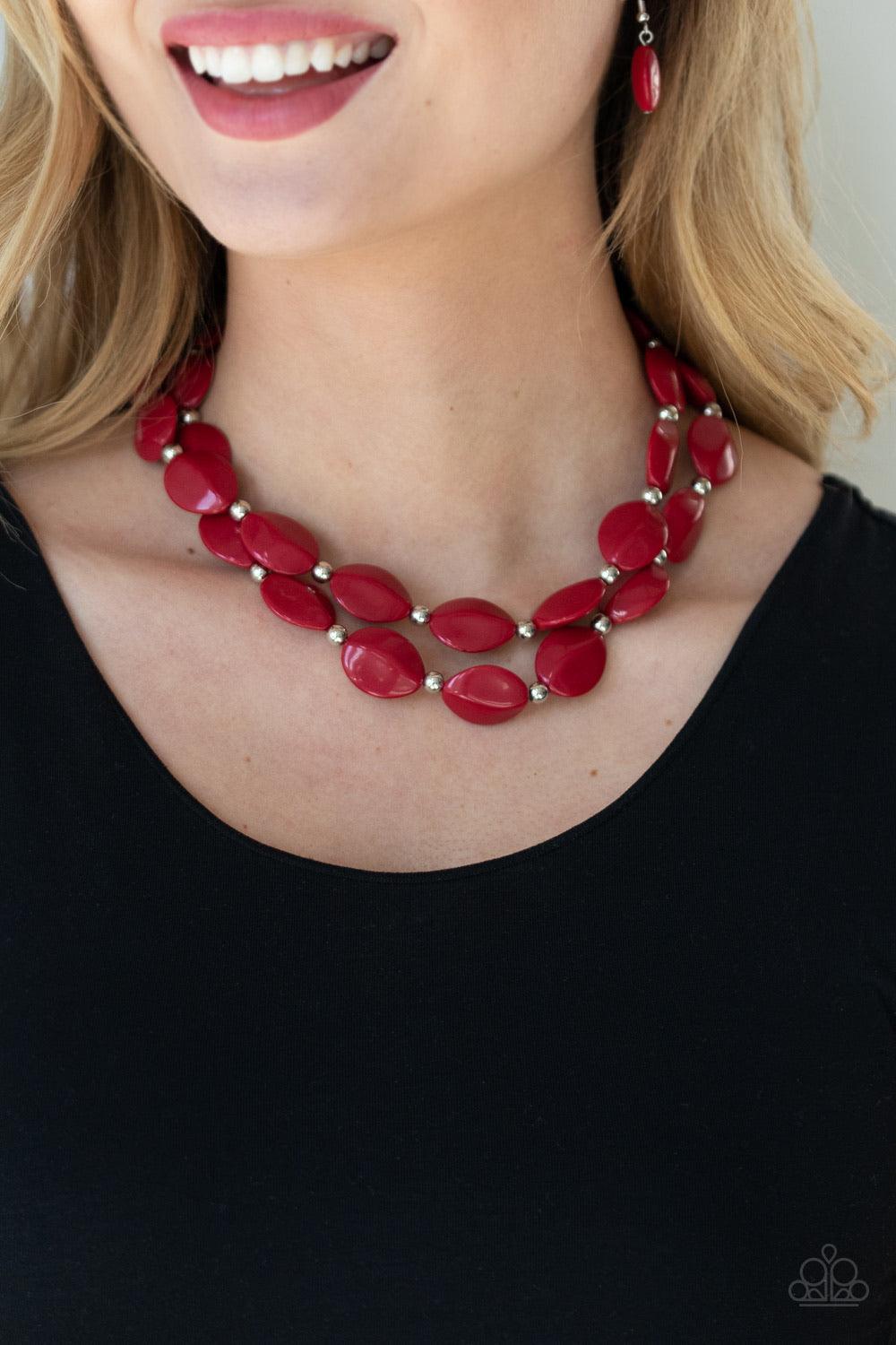 Paparazzi Accessories Two-Story Stunner - Red Two rows of dainty silver beads and faceted Samba faux stone beads alternate along invisible wires below the collar, creating bold, colorful layers. Features an adjustable clasp closure. Sold as one individual