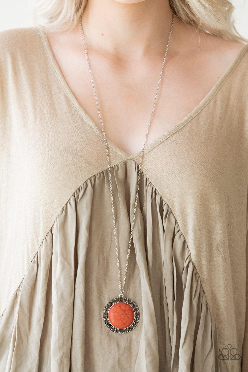 Paparazzi Accessories Run Out Of RODEO - Orange A vivacious orange stone is pressed into the center of a shimmery silver frame radiating with sunburst details. The earthy frame swings from the bottom of a lengthened silver chain for a seasonal finish. Fea