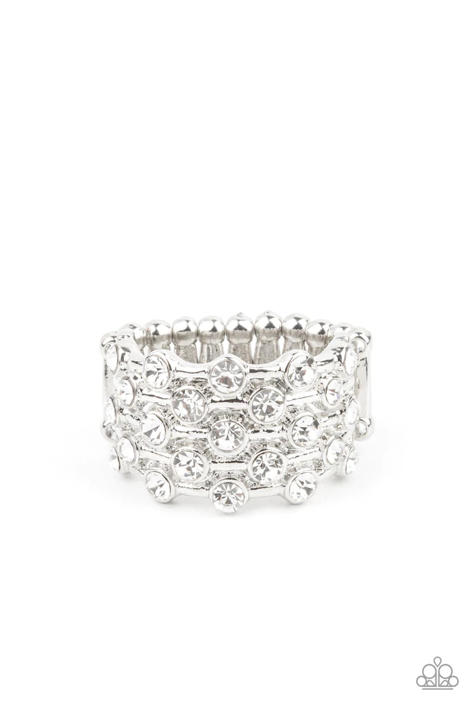 Paparazzi Accessories Metro Motivation- White Sparkling white rhinestones encased in silver frames line up in layers across shiny silver bands creating a shimmering statement atop the finger. Features a stretchy band for a flexible fit. Sold as one indivi