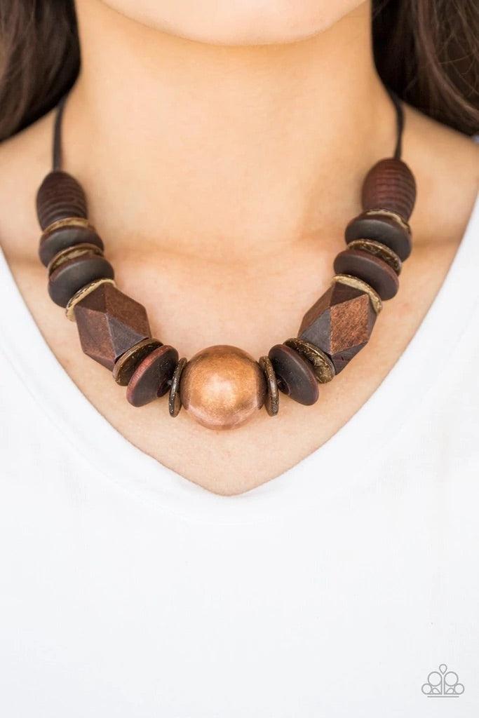Paparazzi Accessories Grand Turks Getaway - Copper Featuring abstract geometric finishes, mismatched brown wooden beads are threaded along shiny brown cording. A dramatic copper bead adorns the center, creating a bold seasonal look below the collar. Featu