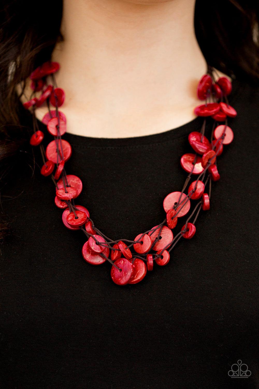 Paparazzi Accessories Bermuda Beach House - Red Tinted in a fiery red finish, distressed wooden discs trickle along strands of knotted brown cording, creating colorful layers below the collar for a seasonal vibe. Features a button-loop closure. Sold as on