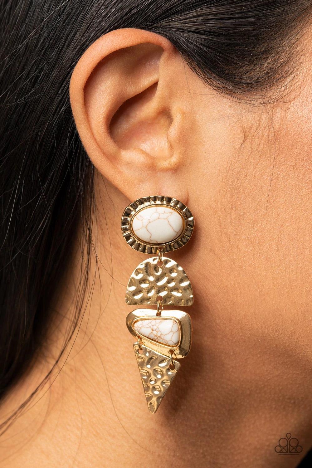 Paparazzi Accessories Earthly Extravagance - Gold Dotted with oval and triangular white stone accents, mismatched gold frames alternate with hammered geometric gold plates, creating an elegantly earthy lure. Earring attaches to a standard post fitting. So