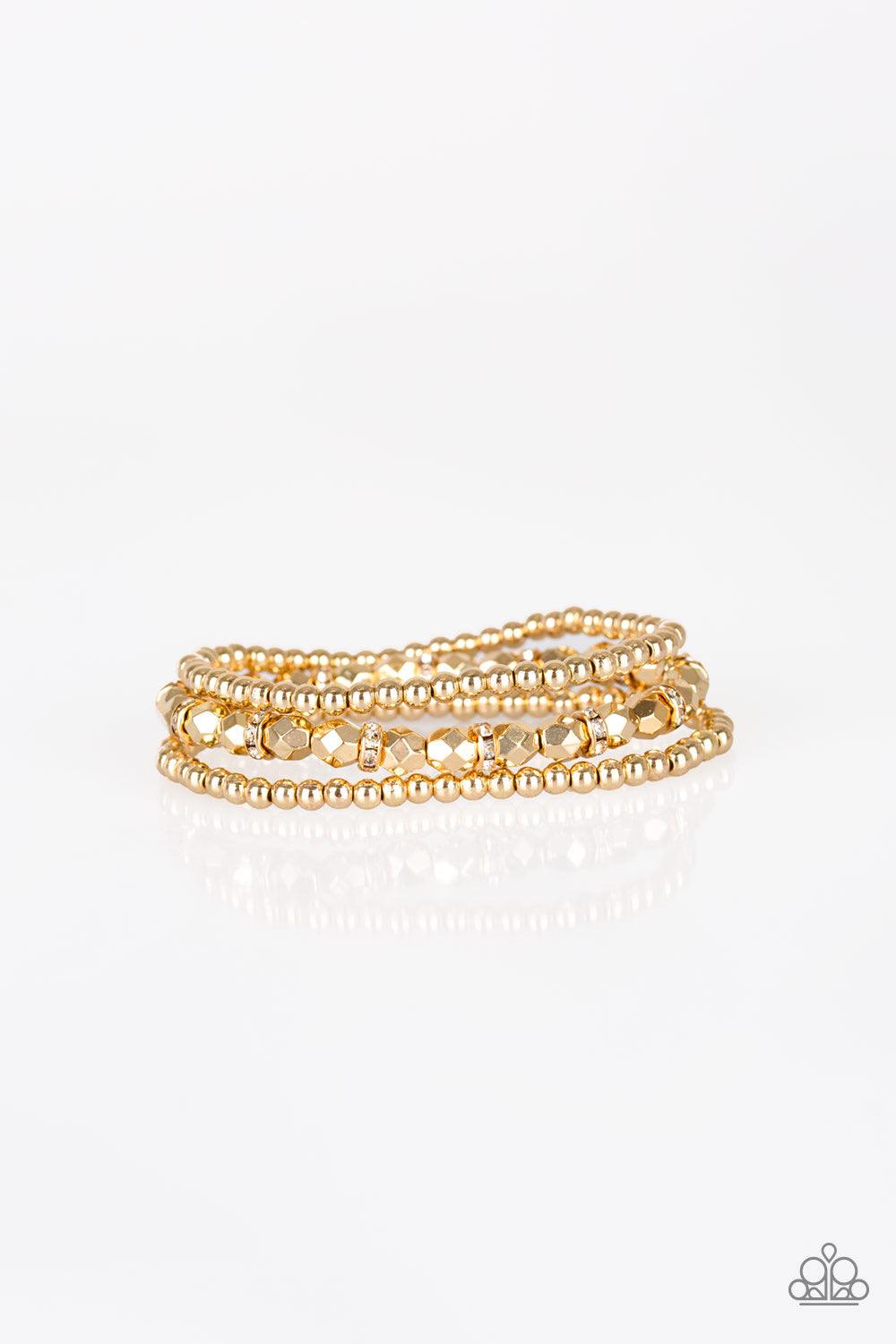 Paparazzi Accessories Let There BEAM Light - Gold Infused with white rhinestone encrusted rings, mismatched dainty silver and faceted gold beads are threaded along stretchy bands for a refined look. Jewelry