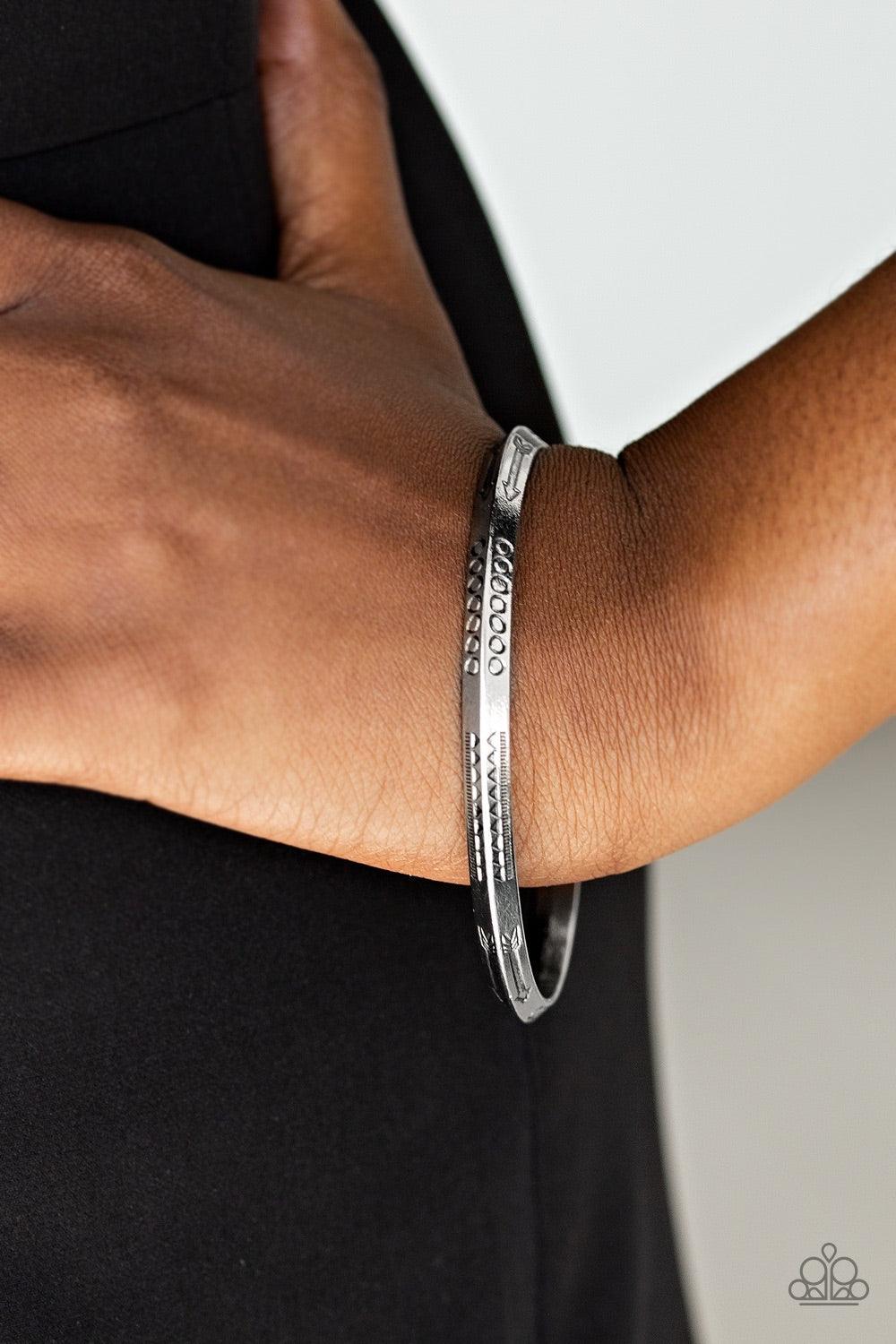 Paparazzi Accessories Aim Higher - Silver Stamped in geometric and arrow patterns, an antiqued silver bangle slides along the wrist for a tribal inspired look. Jewelry
