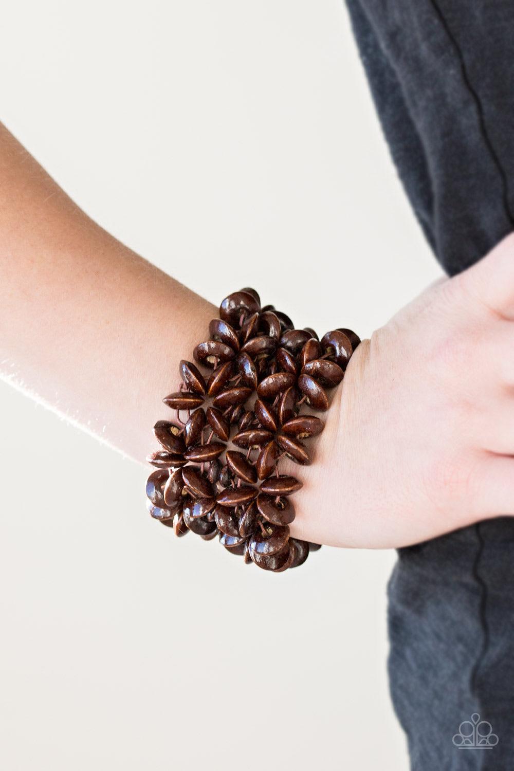 Paparazzi Accessories Hawaii Haven - Brown Earthy brown wooden accents are threaded along elastic stretchy bands, creating summery floral patterns across the wrist for a seasonal look. Sold as one individual bracelet. Jewelry