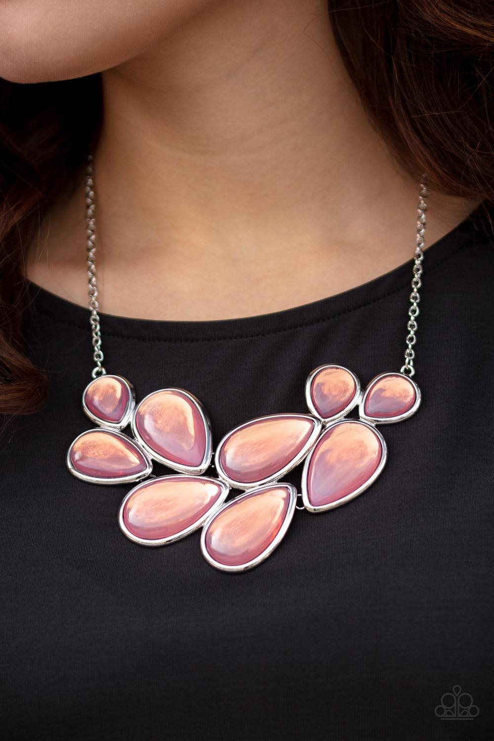 Paparazzi Accessories Iridescently Irresistible - Pink Sleek silver frames encase opalescent pink teardrops that cluster together to create a bubbly statement piece. Features an adjustable clasp closure. Sold as one individual necklace. Includes one pair
